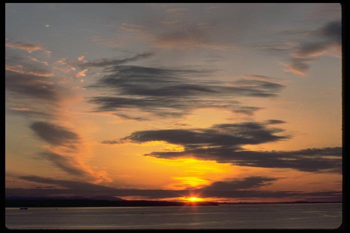 001007 Six Pointed Rays Through Clouds Over Bay A4 Photo Print
