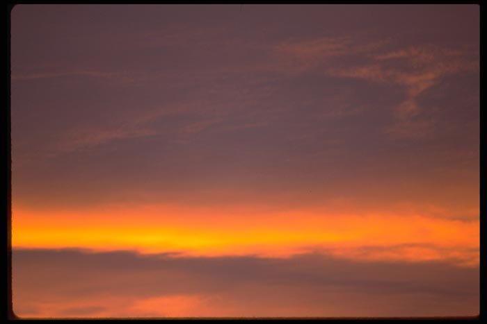 001029 Sunset Glow Behind Clouds A4 Photo Print
