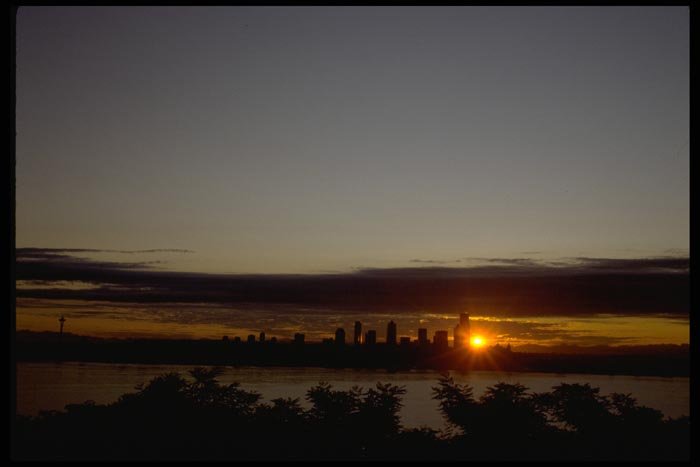 001046 Rayed Sunset Behind City A4 Photo Print