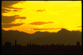 001051 Yellow Sunset Behind Mountains A4 Photo Print