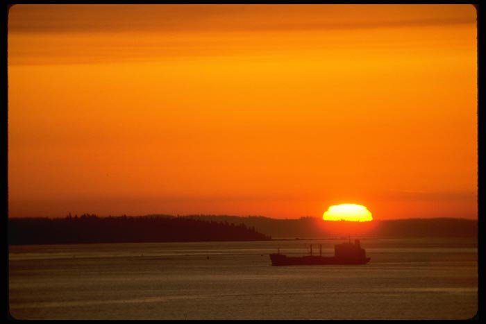 001072 Sun Setting Behind Freighter A4 Photo Print
