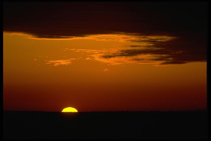 001075 Sun Half Down Over Land A4 Photo Print