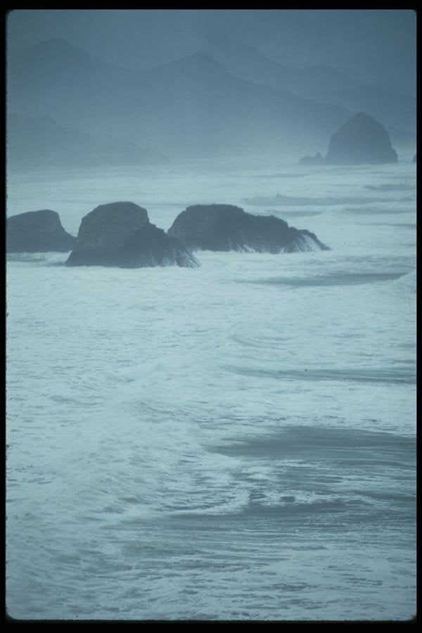 005015 Hazy, Frothy Ocean Near Rocks A4 Photo Print