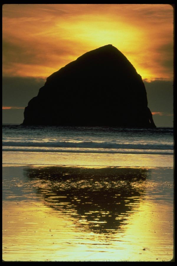 005018 Massive Rock Silhouetted By Sunset A4 Photo Print
