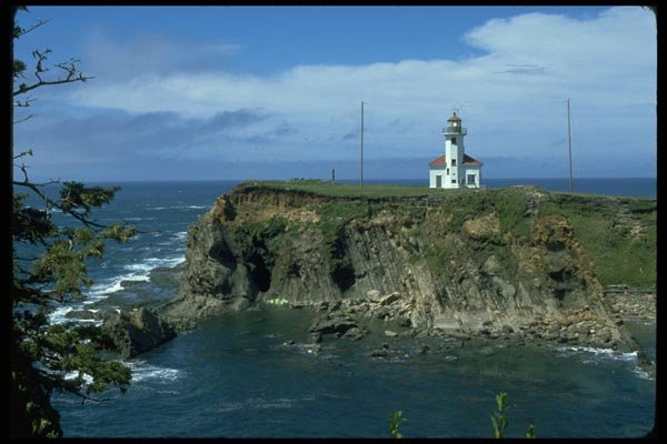 005043 Lighthouse On Rocky Cove A4 Photo Print