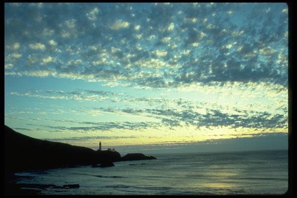 005063 Silhouetted Lighthouse At Dusk A4 Photo Print