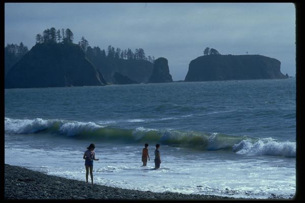 005071 Children Playing In Surf, Islands Behind A4 Photo Print
