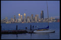 007061 Sloop At Pier With City Skyline A4 Photo Print