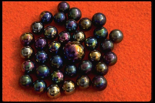 011043 Metallic Marbles On Red Background A4 Photo Print