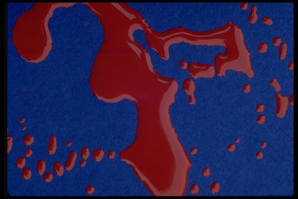 011050 Red Paint Puddles On Blue Background A4 Photo Print
