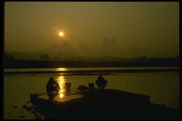 015093 Morning Washday In The Li River, Yangshou A4 Photo Print