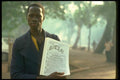 016023 Newspaper Boy In Bamako, Mali A4 Photo Print