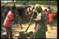 016026 Touarek Village Woman Grinding Grain A4 Photo Print