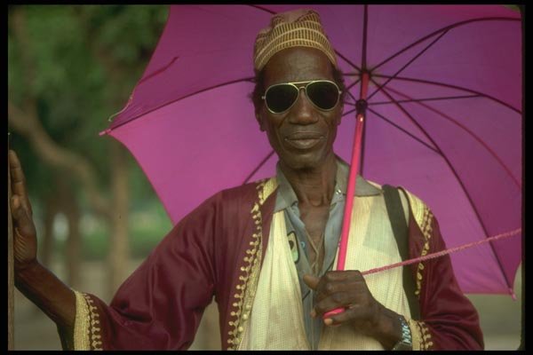 016041 Man With Umbrella, Bamako A4 Photo Print