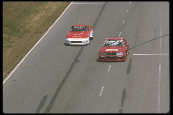 021054 Datsun And Mustang On Straightaway A4 Photo Print