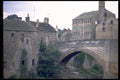 022063 Old Arched Stone Bridge And Buildings A4 Photo Print