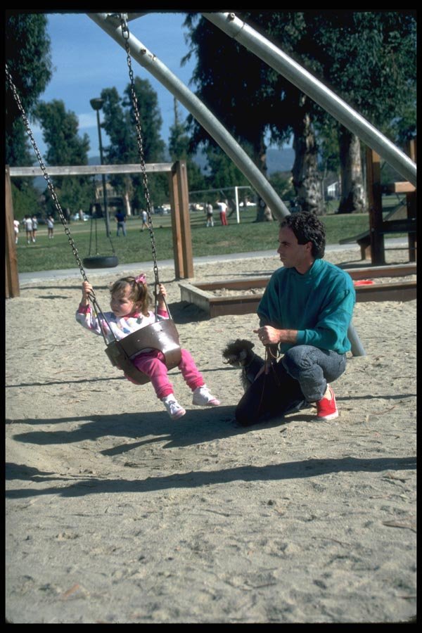 023001 Father And Daughter Swinging In Park A4 Photo Print