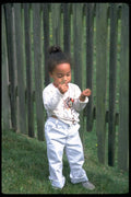 023018 Child With Handful Of Grass A4 Photo Print