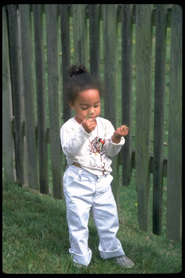 023018 Child With Handful Of Grass A4 Photo Print