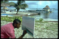 023038 Artist Painting Tropical Scene A4 Photo Print