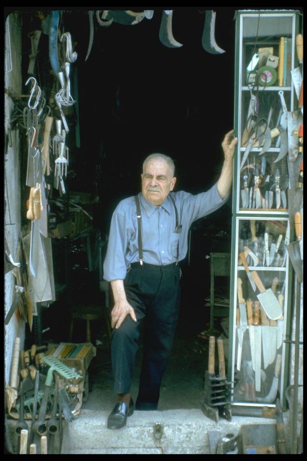 023042 Man In His Store A4 Photo Print