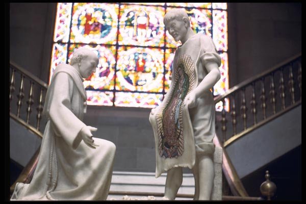024077 Two Statues With Stained Glass Behind A4 Photo Print