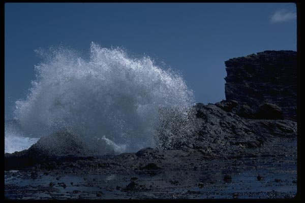 026039 Surf Breaking Over Rock A4 Photo Print