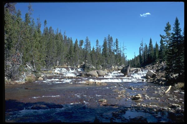 026084 River Falling Through Rocks A4 Photo Print