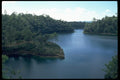 026098 Jagged Shoreline In Wide River A4 Photo Print