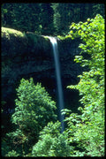 027022 Hikers Behind Waterfall A4 Photo Print