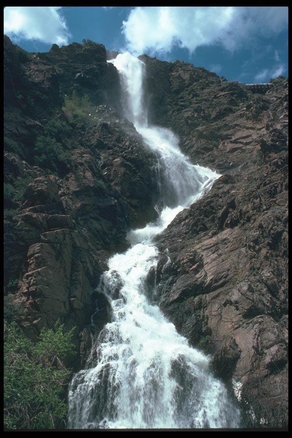 027029 Water Cascading Down Rocky Mountain A4 Photo Print