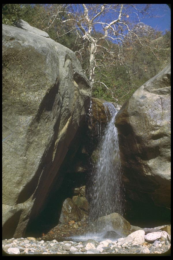 027053 Waterfall Between Two Boulders A4 Photo Print