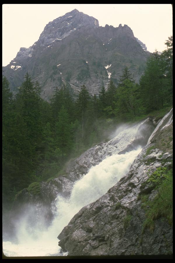 027075 Waterfall With Jagged Mountain A4 Photo Print