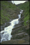 027076 Stream Cascading Down Valley A4 Photo Print