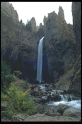 027084 Waterfall Surrounded By Jagged Rocks A4 Photo Print