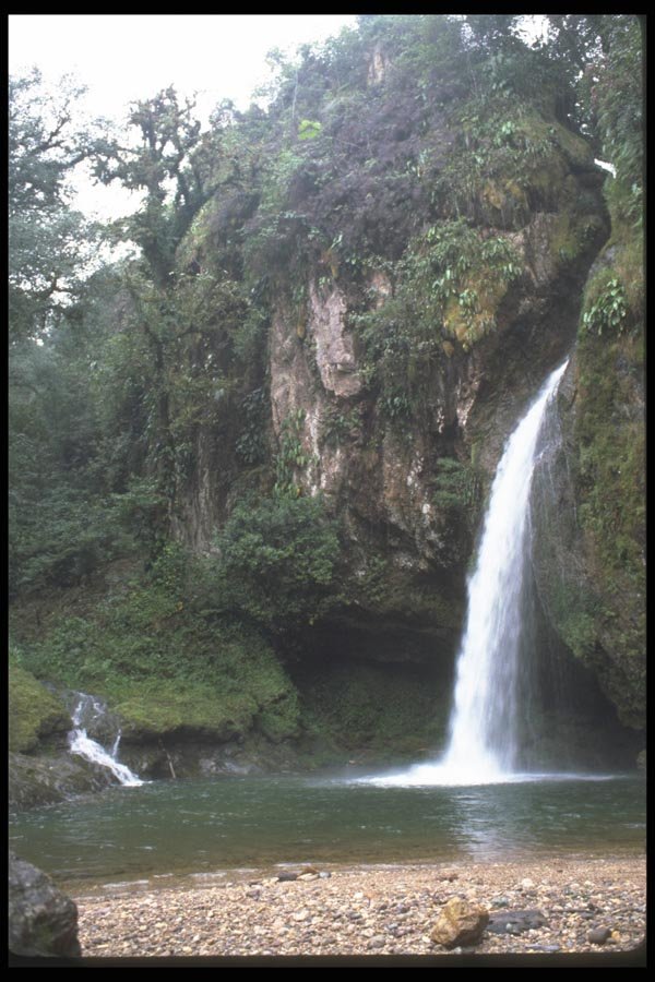 027085 Waterfall Coming Out Of Rocks A4 Photo Print