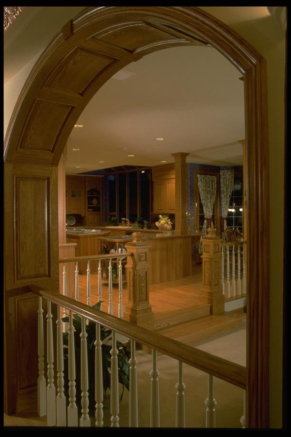 031073 View Of Kitchen Through Wooden Arch A4 Photo Print
