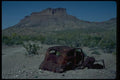 032066 Rusted Antique Car In Front Of Butte A4 Photo Print