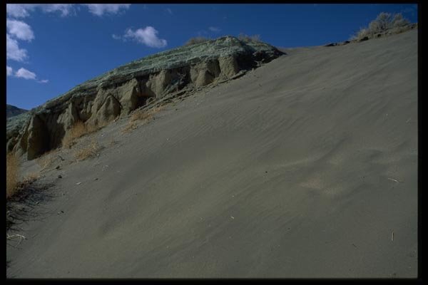 032093 Green Topped Rock Near Sand Dune A4 Photo Print