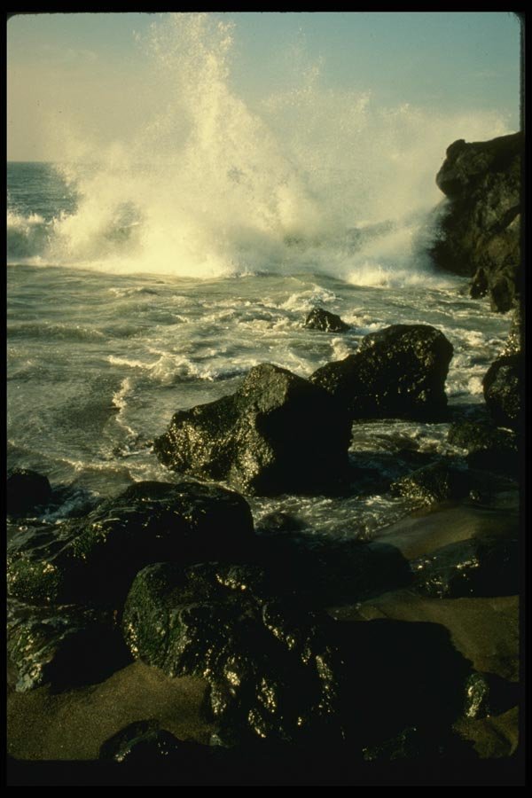 048066 Wave Breaking Over Rocks A4 Photo Print