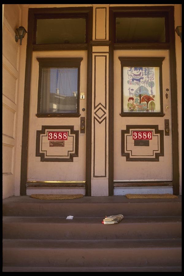 059086 Two Brown Doors And A Newspaper A4 Photo Print