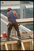 063070 Construction Worker High Above The City A4 Photo Print