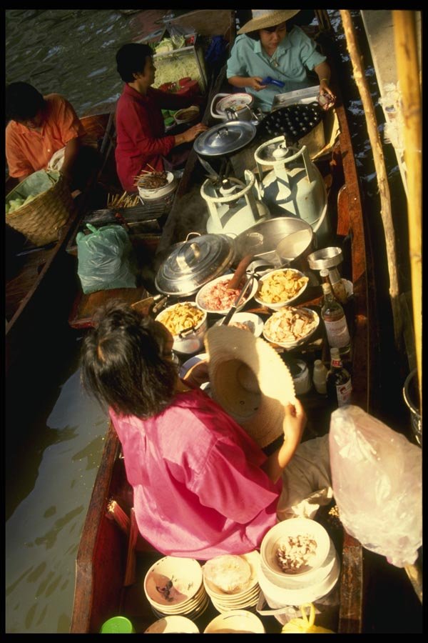076069 Woman Selling Food From Boat A4 Photo Print