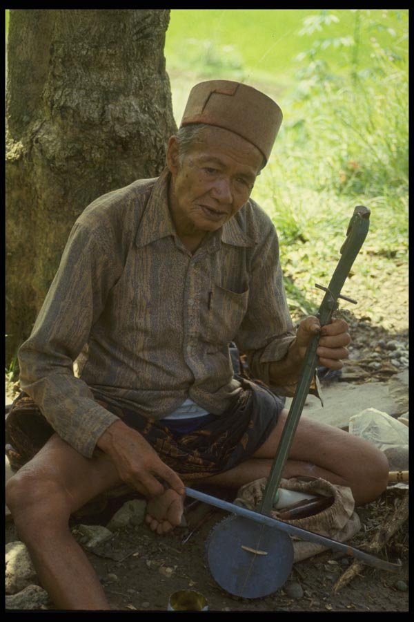 076088 Old Man Playing Instrument A4 Photo Print
