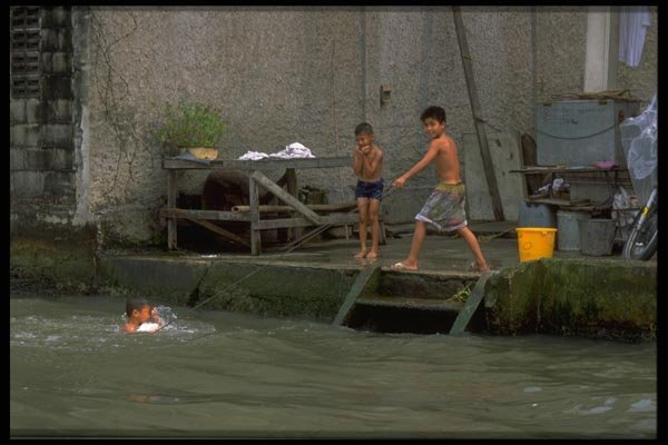 081058 Swimming In Chao Phraya River, Bangkok A4 Photo Print