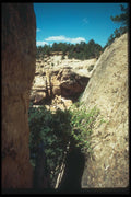 089030 Cliff Palace Thru Rocks A4 Photo Print