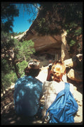 089040 Cliff Palace Visitors On Rock A4 Photo Print