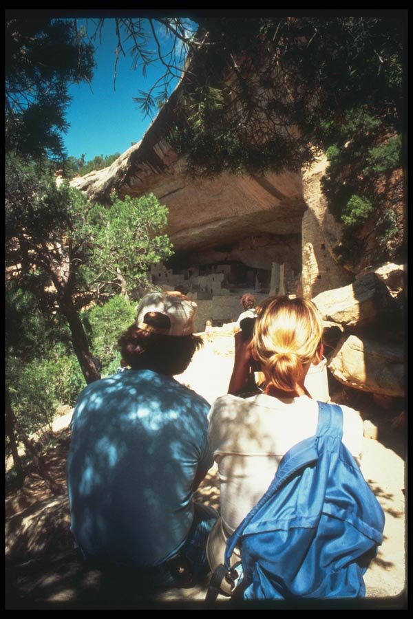 089040 Cliff Palace Visitors On Rock A4 Photo Print