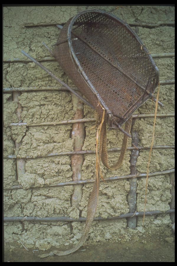 093027 Handmade Backpack On An Adobe Wall In Amazon Village A4 Photo Print
