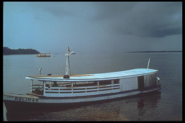 093030 Small Cargo Boat Waiting Out Oncoming Storm A4 Photo Print